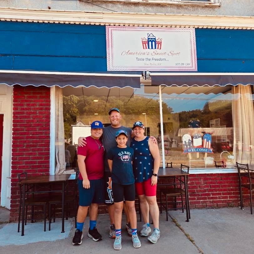 The America's Sweet Spot family standing outside their New Berlin, NY storefront